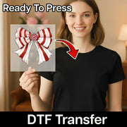A smiling woman in a black shirt holds a clear InkMerge DTF film featuring the Candy Cane Spiral Bow design, labeled Ready To Press for easy heat press application.