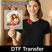 A smiling woman in a black shirt holds InkMerge’s Angelic Christmas Art DTF transfer, showing a sitting angel with wings and flower crown. Text reads "Ready To Press" and "DTF Transfer," with a red arrow pointing to the premium DTF film.