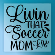 the text "Livin' that soccer mom life" in a stylized font against a blue background.