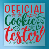 InkMerge's Cookie Tester Holiday Design features "Official Cookie Tester" in festive red and green with a gingerbread man, cookie, carrot, heart, and snowflakes on a light blue background—ready-to-press DTF transfer for the holidays.
