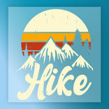 The InkMerge Take A Hike Retro Sunset Design features snow-capped mountains, pine trees, a vintage sunset backdrop, and bold “Hike” text with a worn effect—ideal for heat press transfer projects.