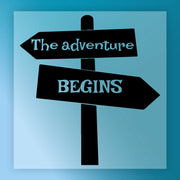 InkMerge’s The Adventure Begins Signpost - Heat Press Ready features a black signpost with two arrows on a blue background, ideal for custom apparel using DTF transfer or heat press techniques.