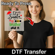 A smiling woman in a black t-shirt holds an InkMerge "Dear Santa My Brother Did It Humor" DTF transfer sheet with playful fonts. Perfect for holiday heat press projects or fun matching sets! Ready To Press and DTF Transfer are featured.