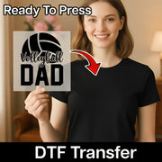 A smiling woman holding a sign with the text "Volleyball Dad" on it, with a red arrow pointing to the sign.