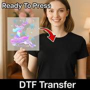 A smiling woman in a black t-shirt holds InkMerge's Merry Christmas Holographic Reindeer Design, ready to press DTF transfer—ideal for your next ugly sweater party. Red arrow and "DTF Transfer" text highlight the festive design.