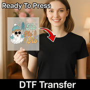 A smiling woman holds an InkMerge Santa Modern Xmas Design DTF transfer. Text says "Ready To Press" and "DTF Transfer," with an arrow pointing to the festive design—perfect for your next heat press project.
