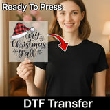 A woman in a black shirt holds the InkMerge Merry Christmas Y'all Festive Design DTF transfer, featuring a red plaid Santa hat, ready to press onto fabric. An arrow points from the transfer to her shirt with "Ready to Press" and "DTF Transfer" text.
