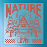 Nature Lover - Heat Press Ready by InkMerge features a cabin amid tall pines, with "NATURE" on top and "LOVER" below, set on a blue background with sun and clouds—ideal for premium DTF film or heat press transfers.