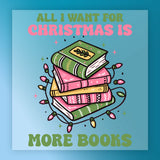 InkMerge’s “All I Want for Christmas Is More Books” DTF transfer features a stack of green and pink books wrapped in colorful lights, bold text above and below, and a blue background—perfect for book lovers this holiday season.