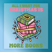 InkMerge’s “All I Want for Christmas Is More Books” DTF transfer features a stack of green and pink books wrapped in colorful lights, bold text above and below, and a blue background—perfect for book lovers this holiday season.