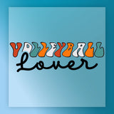 the text "Volleyball Lover" in a stylized font, with the word "Volleyball" written in a colorful, abstract design and "Lover" written in a more traditional, cursive font.