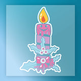 The InkMerge Gothic Holiday Candle Design features a smiling pink candle with melting wax on green holly leaves, white berries, and a red bow, set against a blue gradient—perfect for your next DTF transfer project.
