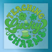 a circular arrangement of text and symbols related to luck and charms, including the words "Teaching Lucky Charms" and various symbols such as a clover, a horseshoe, and a four-leaf clover.