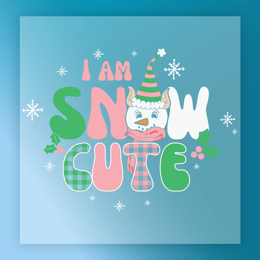 InkMerge’s I Am Snow Cute Holiday Design features “I am snow cute” text with a snowman face for the O, decorated with snowflakes, holly, and pastel colors on blue. Perfect as a ready to press DTF transfer!.