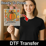 A woman holding a pumpkin-themed graphic with the text "PUNKIN PUMPKIN PUMPKIN SEASON" and a red arrow pointing to the graphic.