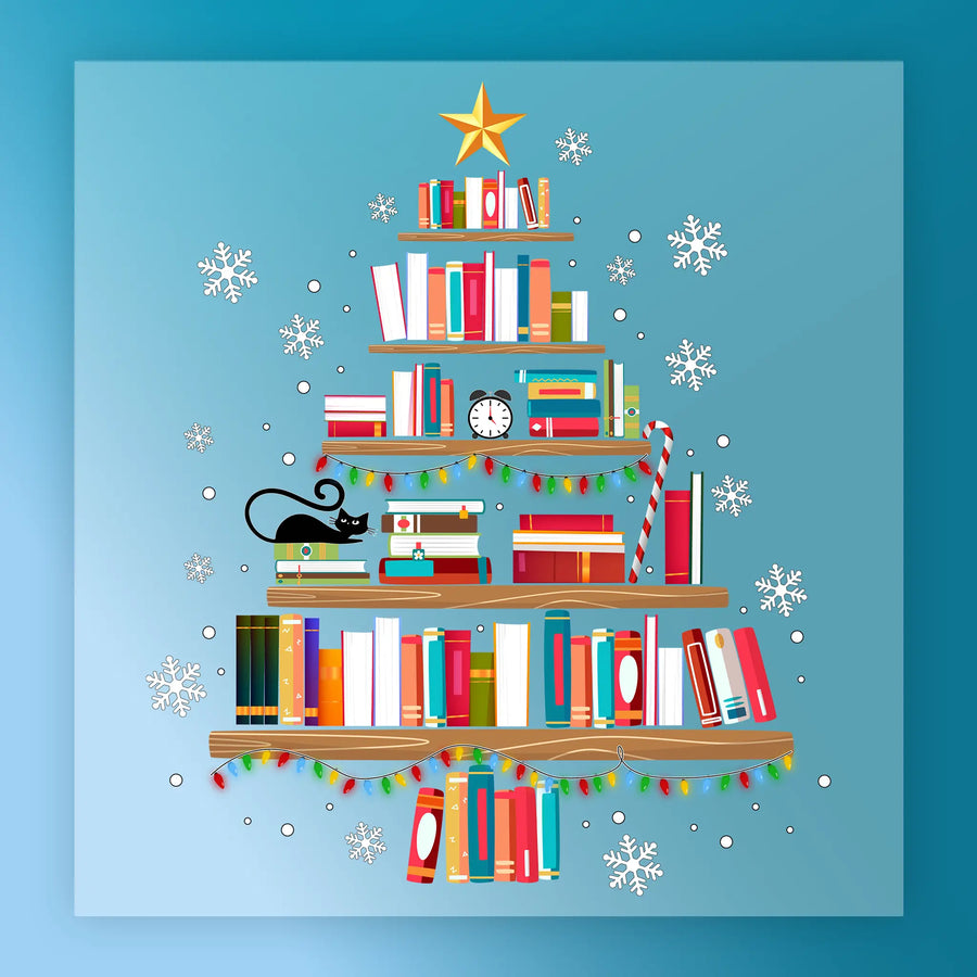 The InkMerge Book Christmas Tree Design - Heat Press Ready showcases stacked books with a star, lights, clock, cat, and ornaments—ideal for Christmas garments on a snowy blue background.