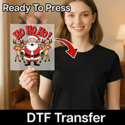 A smiling woman in a black shirt holds InkMerge’s “Ho Ho Ho Santa and Reindeer” DTF transfer. A red arrow points from the festive Christmas design to her shirt. Text reads “Ready To Press” and “DTF Transfer.”.