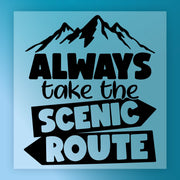The Always Take the Scenic Route DTF transfer by InkMerge features a blue square with a black mountain above “ALWAYS take the SCENIC ROUTE” in bold fonts, with SCENIC ROUTE inside arrows—precut DTF film ready for your heat press.