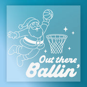 Santa Claus is shown jumping to dunk a basketball into a hoop, with the text "Out there Ballin'" below the illustration.