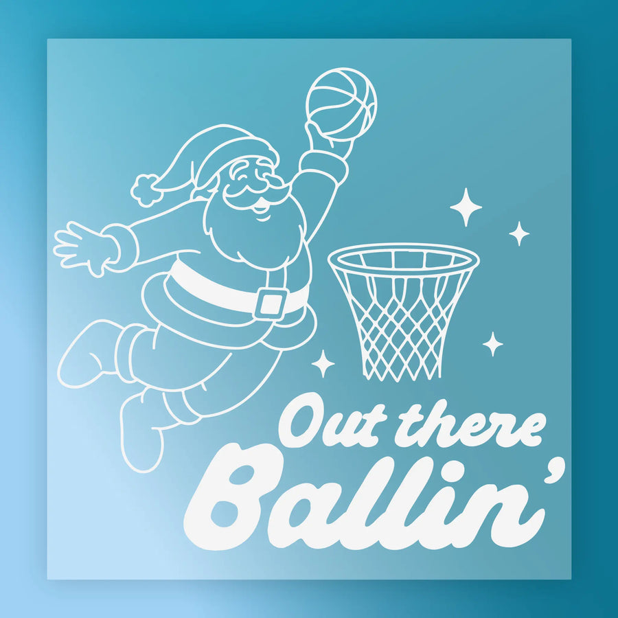 Santa Claus is shown jumping to dunk a basketball into a hoop, with the text "Out there Ballin'" below the illustration.