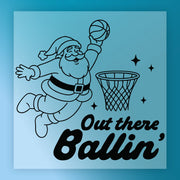 Santa Claus is shown jumping to hit a basketball through a hoop, with the text "Out there Ballin'" below the illustration.