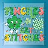a colorful and whimsical design with the text "PINCHES GET STITCHES" prominently displayed. The design includes a green clover with arms and legs, a checkered shamrock, and other decorative elements.