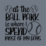 At the Ball Park DTF Transfer by InkMerge features baseball graphics and the phrase "At the ball park is where I spend most of my days" on a gray background. Ready to press, this precut transfer includes baseballs above and beside the text.