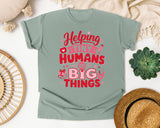 Helping Tiny Humans Do Big Things Red graphic tee in Bay