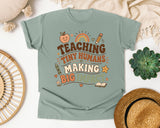 Teaching Tiny Humans Making Big Impact graphic tee in Bay