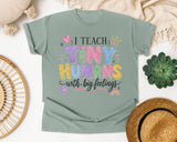I Teach Tiny Humans With Big Feelings graphic tee in Bay