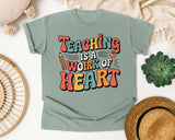 Teaching Is A Work Of Heart Grey graphic tee in Bay