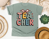 Teacher Bow Patterned Graphic Tee graphic tee in Bay