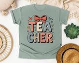 Teacher Stacked Bow Graphic Tee graphic tee in Bay