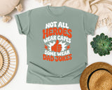Not All Heroes Wear Capes Some Wear Dad Jokes Orange 2 graphic tee in Bay