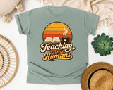Teaching Tiny Humans Retro Sunset graphic tee in Bay