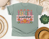 Teaching Is A Work Of Heart Flowers graphic tee in Bay