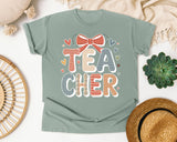 Teacher Bow Striped Graphic Tee graphic tee in Bay