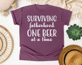 Surviving Fatherhood One Beer At A Time Classic graphic tee in Berry