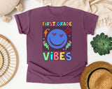 First Grade Vibes Checkered Smiley graphic tee in Berry
