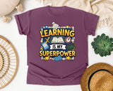 Learning Is My Superpower graphic tee in Berry