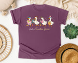 Just A Teacher Goose graphic tee in Berry