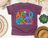 Learning ABCD Rocks graphic tee in Berry