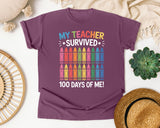 My Teacher Survived 100 Days Of Me Crayons graphic tee in Berry