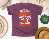 Not All Heroes Wear Capes Some Wear Dad Jokes Orange 2 graphic tee in Berry