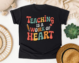 Teaching Is A Work Of Heart Grey graphic tee in Black
