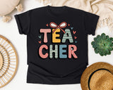 Teacher Bow Patterned Graphic Tee graphic tee in Black