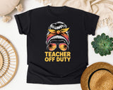 Teacher Off Duty Messy Bun Sunset graphic tee in Black