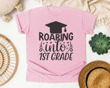 Roaring Into 1st Grade White graphic tee in Blossom