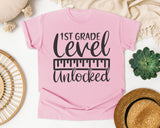 1st Grade Level Unlocked Grey graphic tee in Blossom