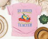 She Believed She Could Change The World So She Became A Teacher graphic tee in Blossom